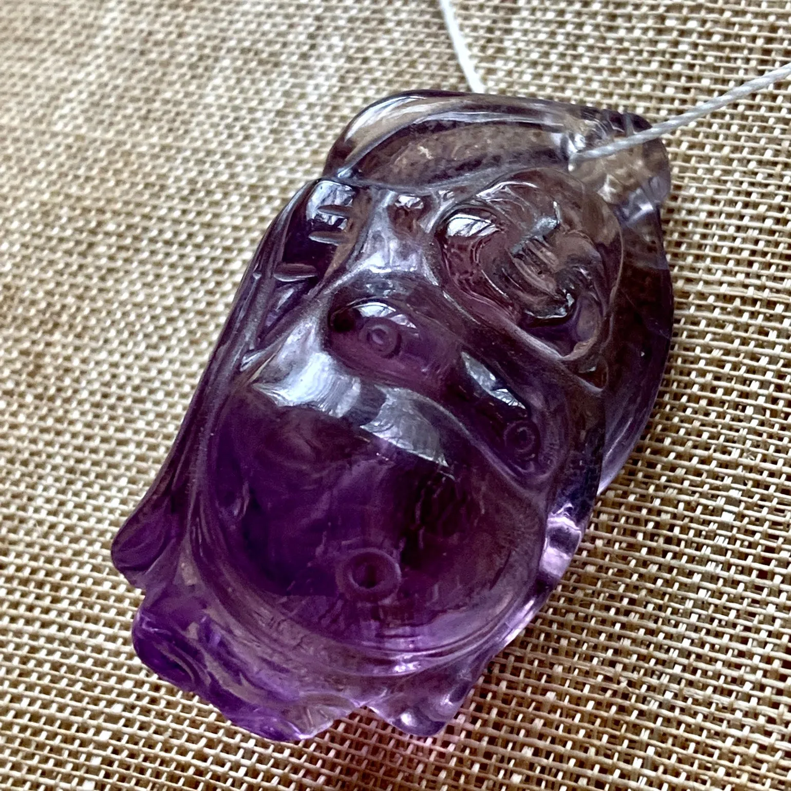 Carved Amethyst Buddha Pendant