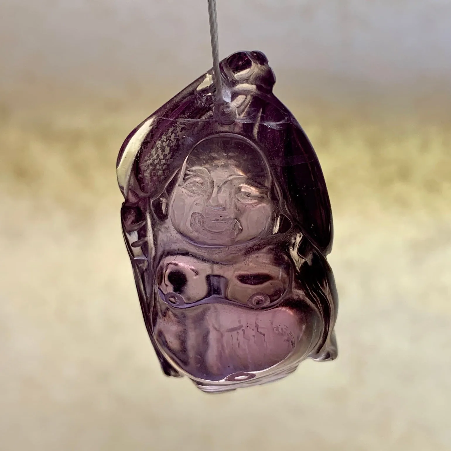 Carved Amethyst Buddha Pendant