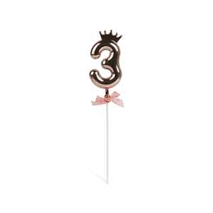 Number 3 on a stick with a rose gold crown